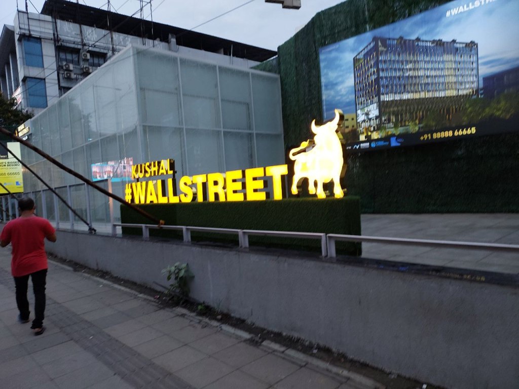 Somebody making a  real-life replica of Wall Street on F.C. Road (Commercial, all glass)